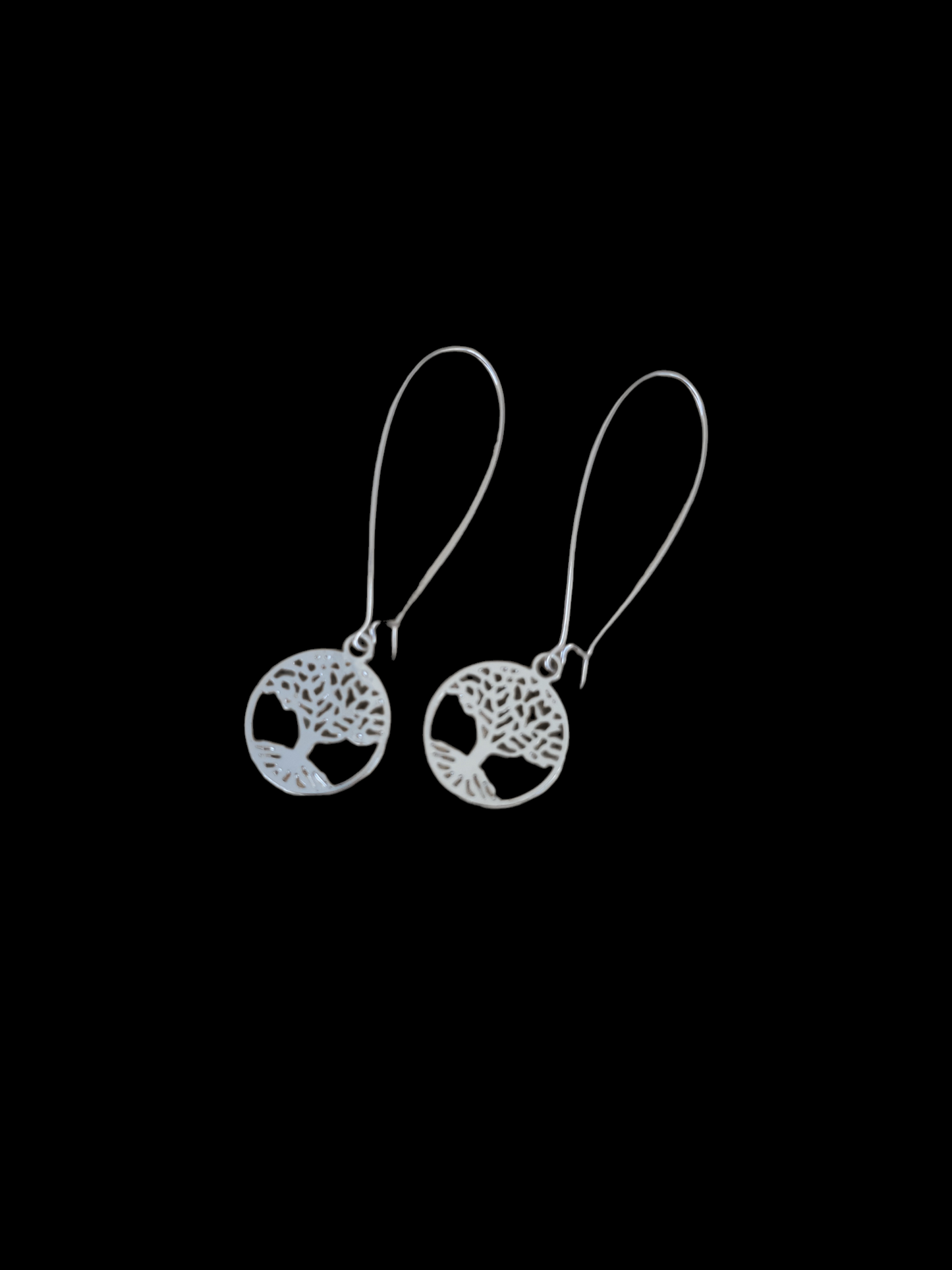 Long, silver earrings featuring a Tree of Life charm with kidney wire hooks